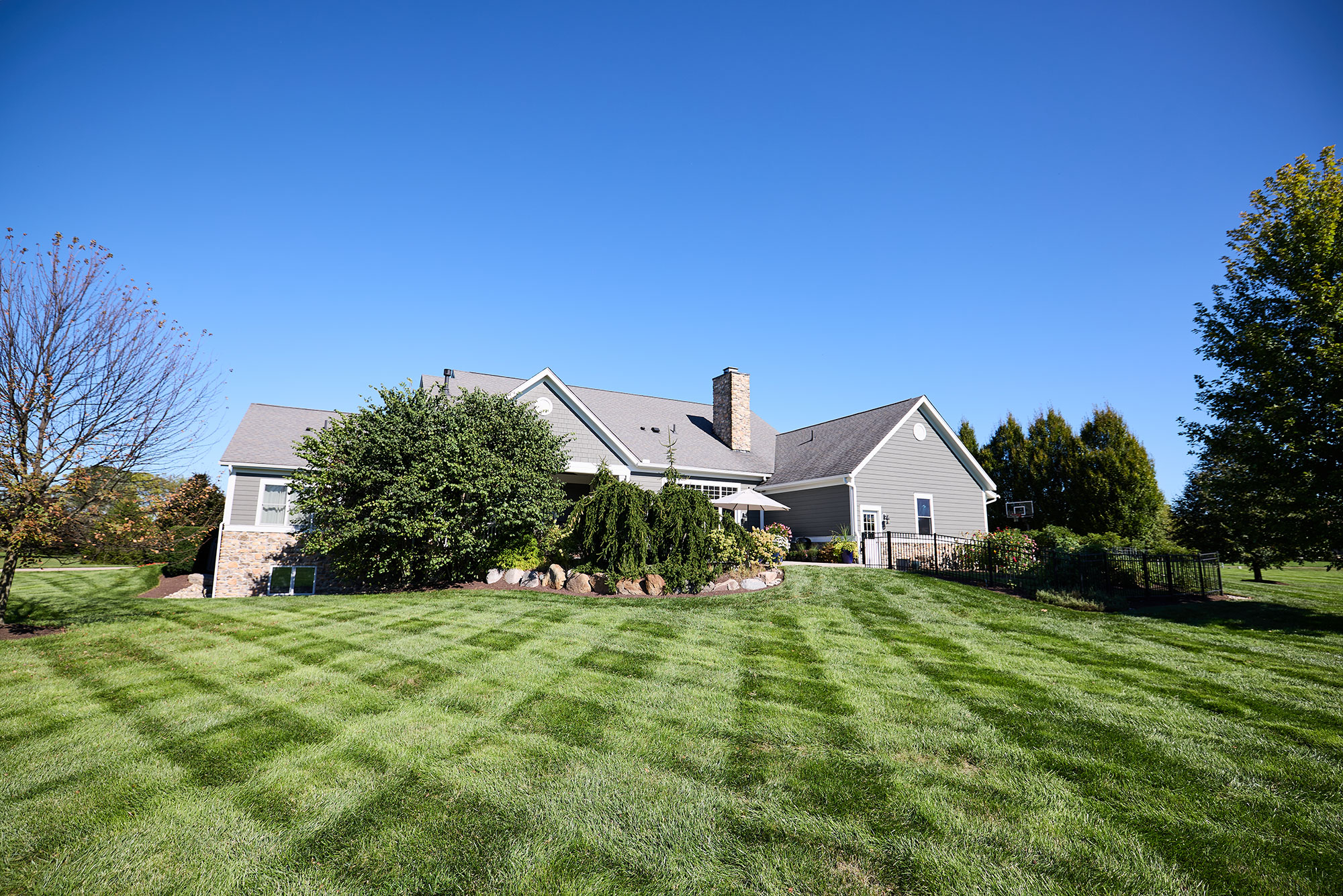 House with lawn showing mowing rows