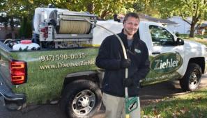 man in front of truck with equipment